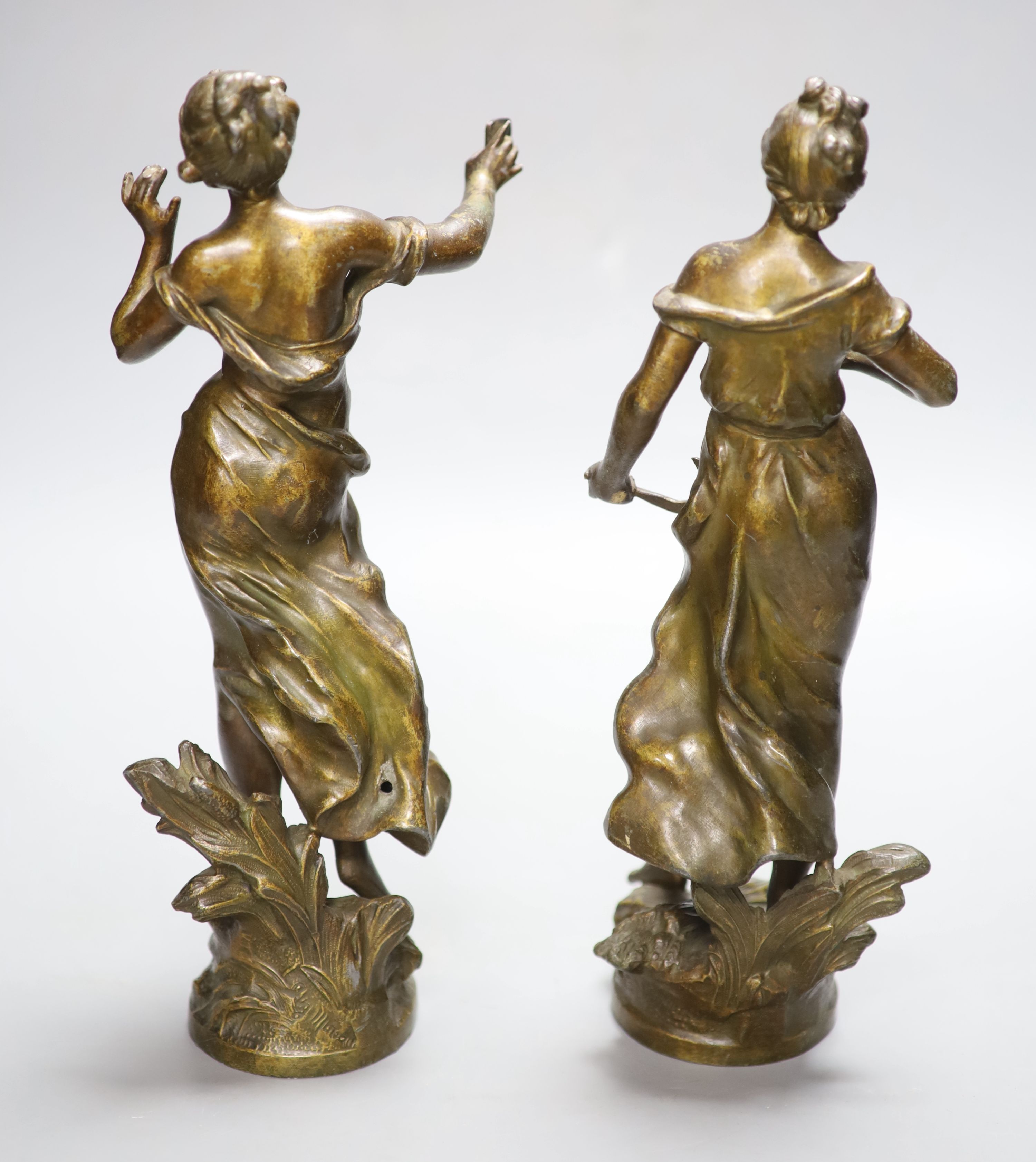 After Moreau. A pair of spelter females, height 31cm